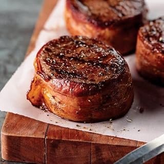 Omaha Steaks Ultimate Gift Collection (Bacon-Wrapped Butcher's Cut Ribeye Filets, Beef Sirloin Tips, PureGround® Filet Mignon Burgers, Kielbasa Sausages, Stuffed Baked Potatoes, and more)