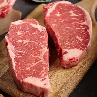 Premium USDA Prime Kansas City Strip Steaks, 12-count, 16 oz each, wet-aged up to 28 days, robustly marbled for unmatched flavor. Restaurant-quality beef steaks from Kansas City Steak Company.